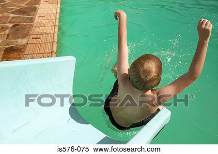 Boy enjoying waterslide View Large Photo Image Stock Photography - Boy enjoying waterslide. Fotosearch