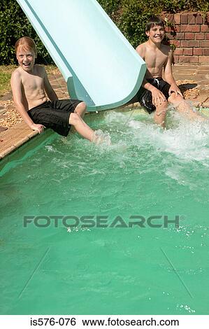 Boys enjoying the pool View Large Photo Image Stock Photograph - Boys enjoying the pool. Fotosearch