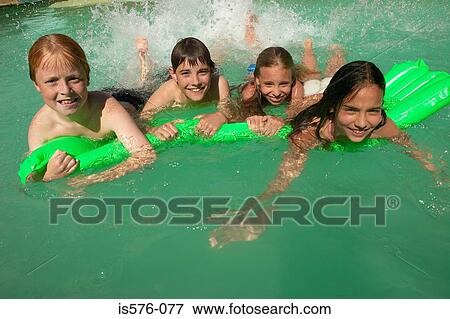 Children enjoying the pool View Large Photo Image Stock Photo - Children enjoying the pool. Fotosearch