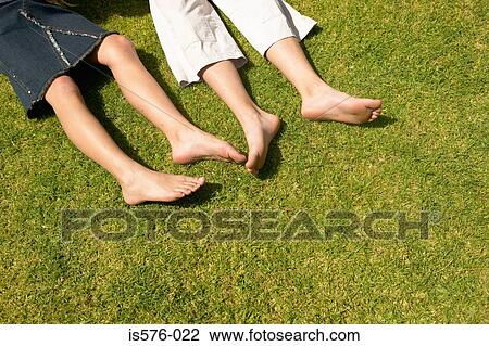 Children lying on the grass View Large Photo Image Stock Image - Children lying on the grass. Fotosearch
