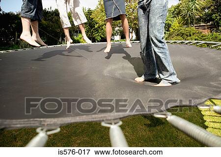 Stock Photo - Children on trampoline. Fotosearch