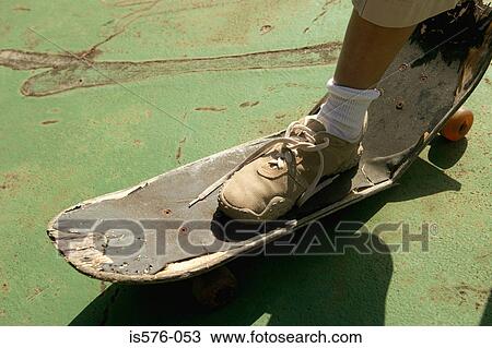 Foot on broken skateboard View Large Photo Image Stock Image - Foot on broken skateboard. Fotosearch