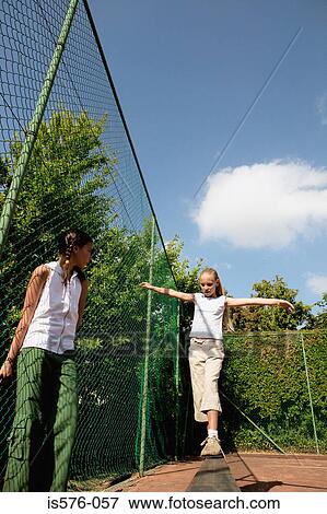 Girls playing outdoors View Large Photo Image Stock Photo - Girls playing outdoors. Fotosearch