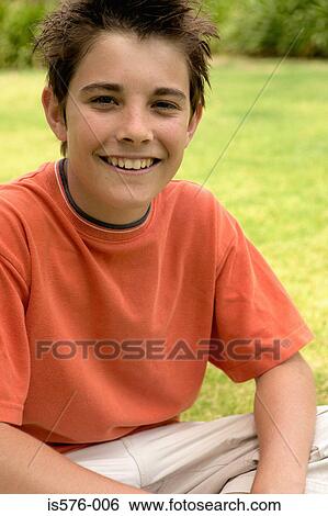 Young boy smiling at camera View Large Photo Image Stock Photograph - Young boy smiling at camera. Fotosearch