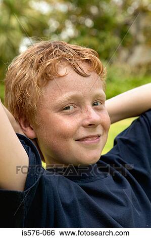 Young boy smiling at camera View Large Photo Image Stock Photograph - Young boy smiling at camera. Fotosearch