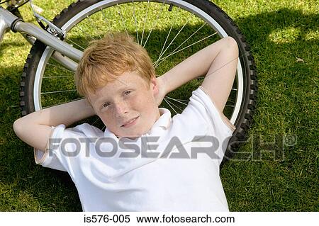 Young boy smiling at camera View Large Photo Image Stock Photography - Young boy smiling at camera. Fotosearch