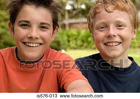 Stock Image - Young boys smiling at camera. Fotosearch