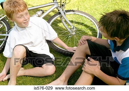 Stock Photo - Young boys with bicycle. Fotosearch