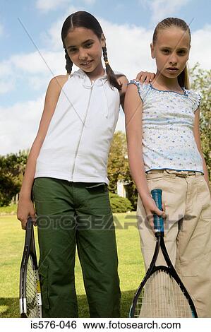 Stock Photograph - Young girls with racquets. Fotosearch