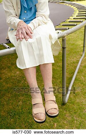 Stock Image - Cropped shot of older woman. Fotosearch