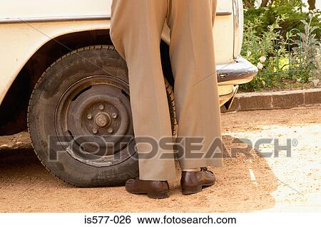 Legs of older man with car View Large Photo Image Stock Photograph - Legs of older man with car. Fotosearch