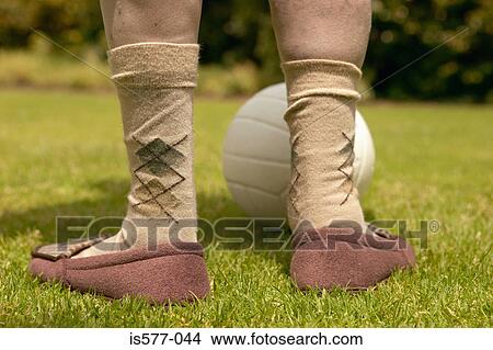 Legs of older person with ball View Large Photo Image Picture - Legs of older person with ball. Fotosearch