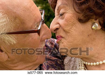 Stock Photography - Older couple about to kiss. Fotosearch