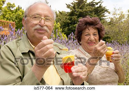 Older couple enjoying dessert View Large Photo Image Picture - Older couple enjoying dessert. Fotosearch