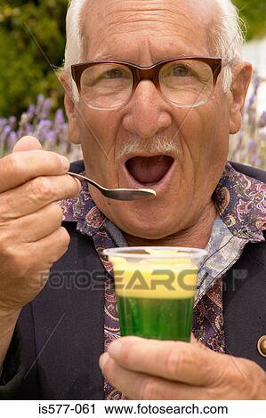 Older man eating dessert View Large Photo Image Stock Image - Older man eating dessert. Fotosearch