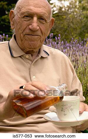 Older man with drink & teacup View Large Photo Image Stock Image - Older man with drink & teacup. Fotosearch