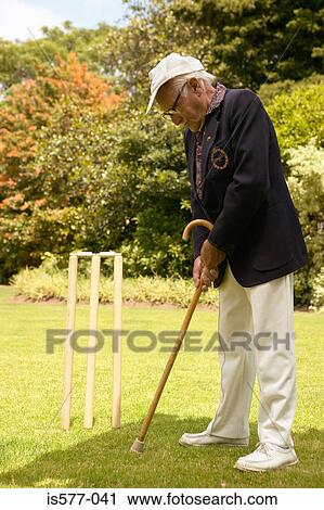 Older man with walking stick View Large Photo Image Stock Image - Older man with walking stick. Fotosearch