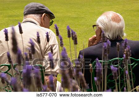 Older men relaxing outdoors View Large Photo Image Stock Image - Older men relaxing outdoors. Fotosearch