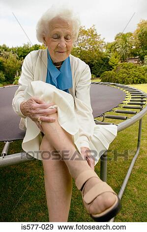 Older woman in the garden View Large Photo Image Stock Photo - Older woman in the garden. Fotosearch