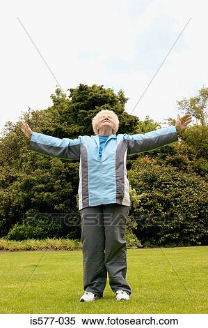 Older woman stretches outside View Large Photo Image Stock Photography - Older woman stretches outside. Fotosearch