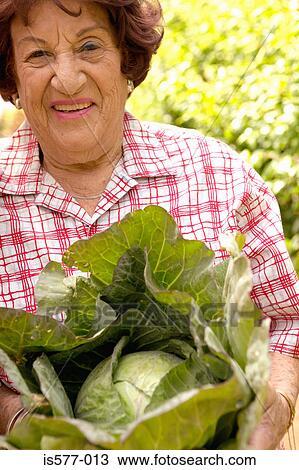 Older woman with cabbage View Large Photo Image Stock Image - Older woman with cabbage. Fotosearch