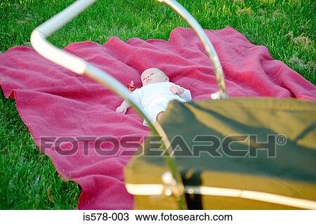 Baby chilling out on pink throw View Large Photo Image Stock Image - Baby chilling out on pink throw. Fotosearch