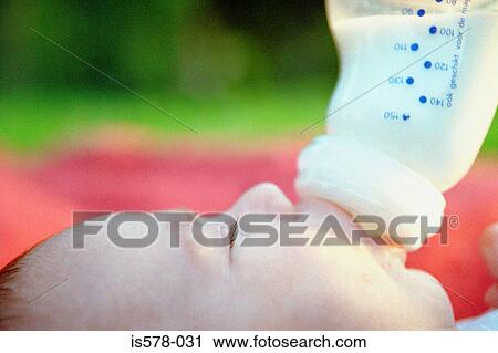 Baby drinking milk View Large Photo Image Stock Image - Baby drinking milk . Fotosearch