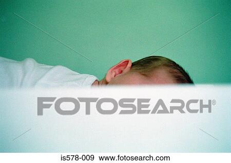 Baby lying down View Large Photo Image Stock Photo - Baby lying down. Fotosearch