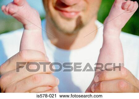 Stock Image - Dad with baby. Fotosearch