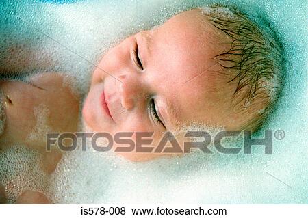 Stock Photo - Soapy happy baby. Fotosearch