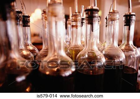 Picture - Bottles of vinegar dressing. Fotosearch