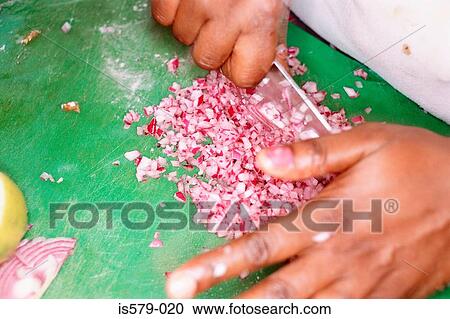 Stock Image - Chef chopping onions. Fotosearch