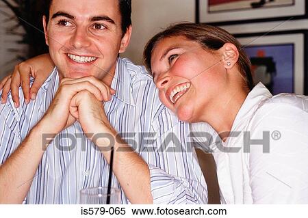Stock Photography - Happy young couple in bar. Fotosearch