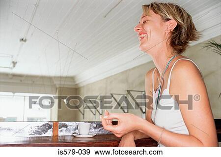 Happy young woman in cafe View Large Photo Image Stock Photo - Happy young woman in cafe. Fotosearch