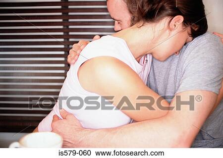 Stock Image - Intimate couple hugging. Fotosearch