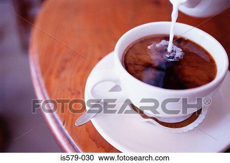 Making a white coffee View Large Photo Image Stock Image - Making a white coffee. Fotosearch