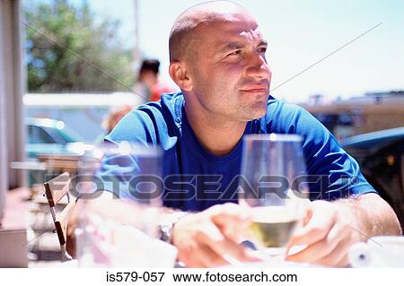 Man with glass of beer outside View Large Photo Image Stock Photo - Man with glass of beer outside. Fotosearch