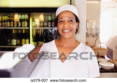 Stock Photo - Smiling female chef. Fotosearch
