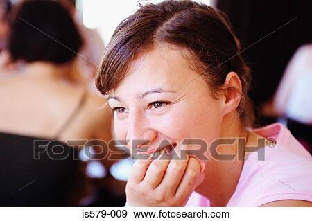 Smiling young woman in cafe View Large Photo Image Stock Photo - Smiling young woman in cafe. Fotosearch