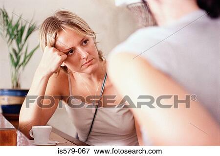 Stock Photo - Unhappy young woman at bar. Fotosearch