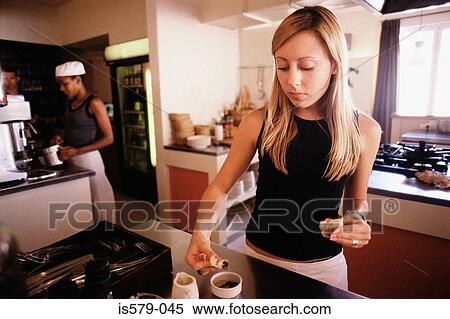 Stock Photography - Waitress in kitchen. Fotosearch