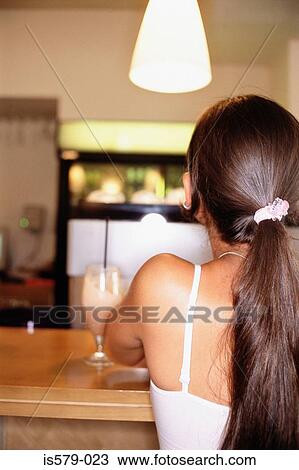 Young woman at the bar View Large Photo Image Stock Image - Young woman at the bar. Fotosearch