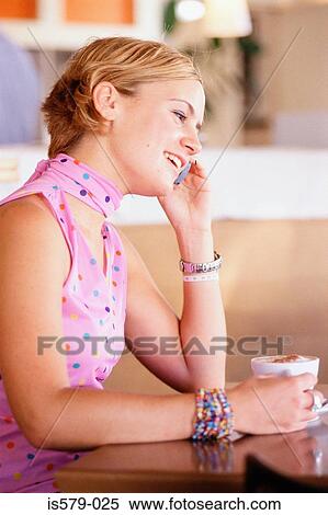 Young woman on mobile phone View Large Photo Image Stock Photography - Young woman on mobile phone. Fotosearch