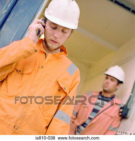 Construction worker using cellular telephone View Large Photo Image Stock Photo - Construction worker using cellular telephone. Fotosearch