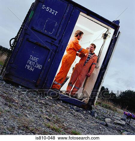 Construction workers in cargo container View Large Photo Image Stock Photo - Construction workers in cargo container. Fotosearch