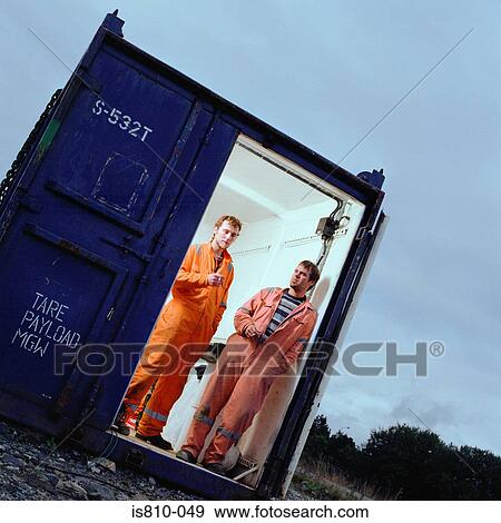 Construction workers in cargo container View Large Photo Image Stock Photo - Construction workers in cargo container. Fotosearch