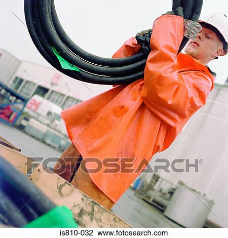 Engineer holding pipe View Large Photo Image Stock Image - Engineer holding pipe. Fotosearch