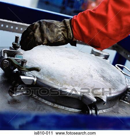 Stock Image - Engineer with machinery. Fotosearch