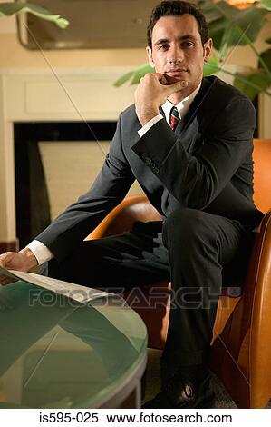 Businessman in hotel lobby View Large Photo Image Stock Photography - Businessman in hotel lobby. Fotosearch