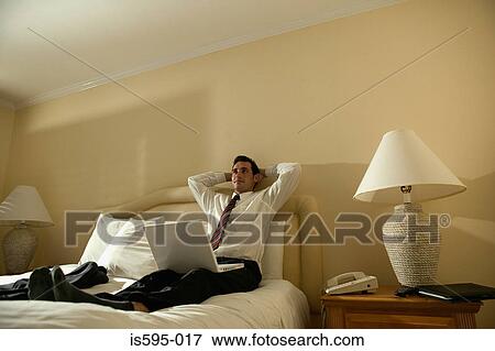 Businessman in hotel room View Large Photo Image Stock Photo - Businessman in hotel room. Fotosearch